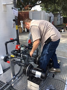 Image of a man installing water treatment system