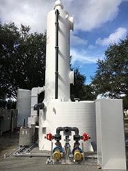 Ammonia scrubber system - vertically packed tower with recirculating solution neutralizing ammonia gas.