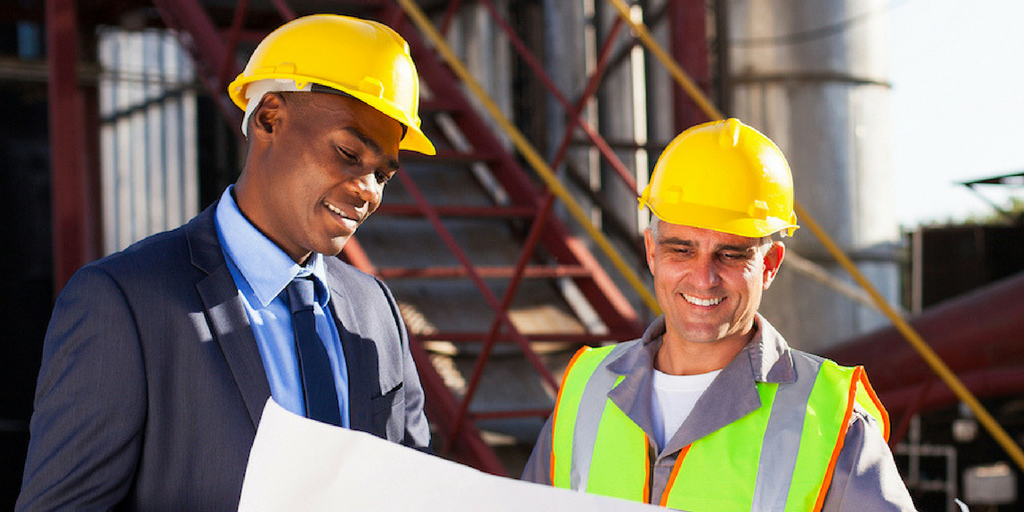 Engineers looking at building map