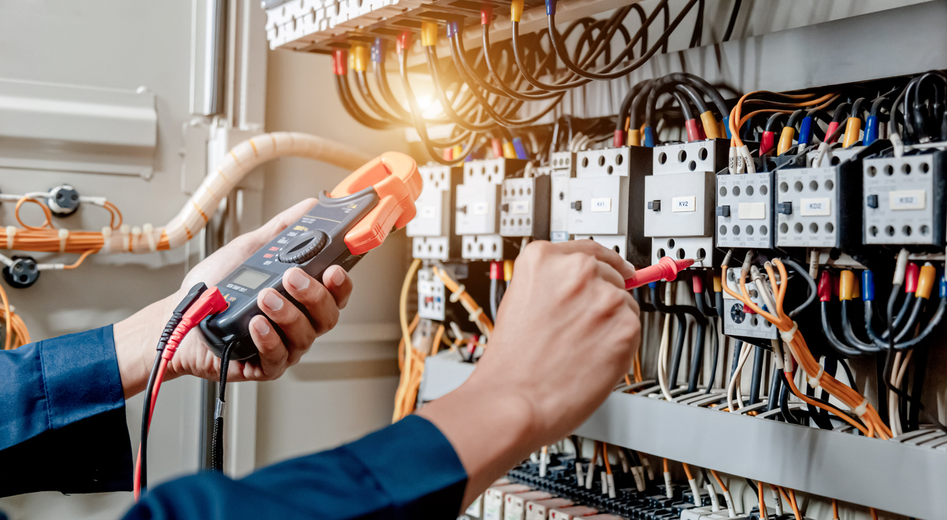 Men testing industrial panel Men testing industrial panel